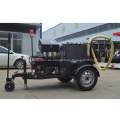 Máquina de sellado de grietas para la reparación de carreteras de asfalto de remolque